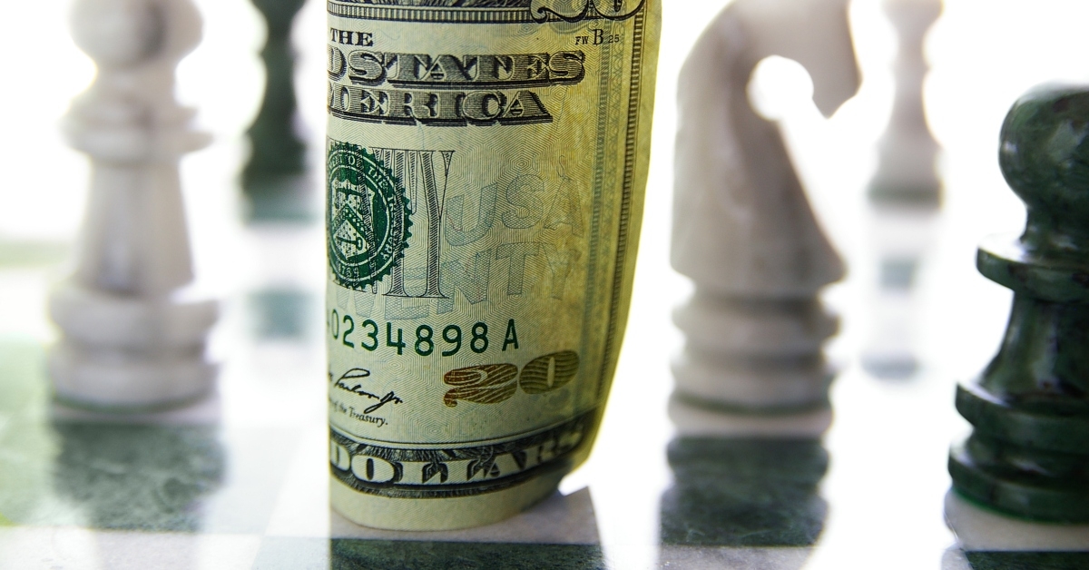 twenty dollar bill on a chess board
