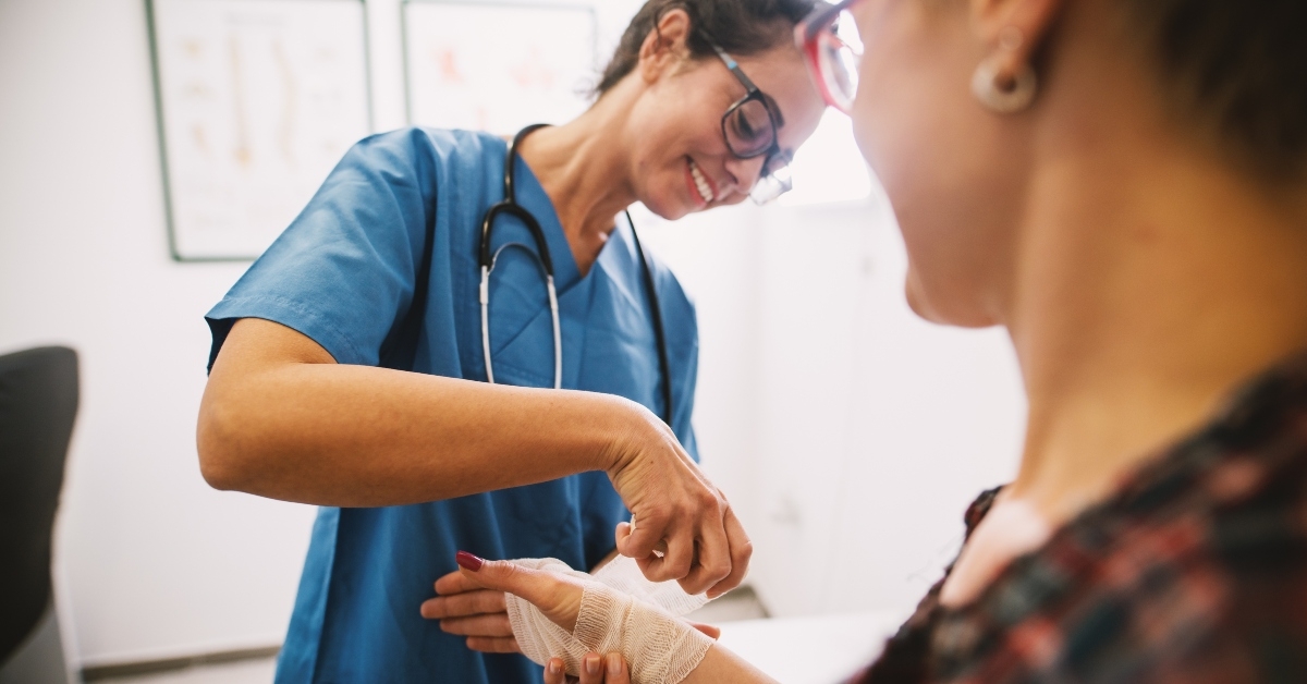 nurse at the hospital bandaging the hand