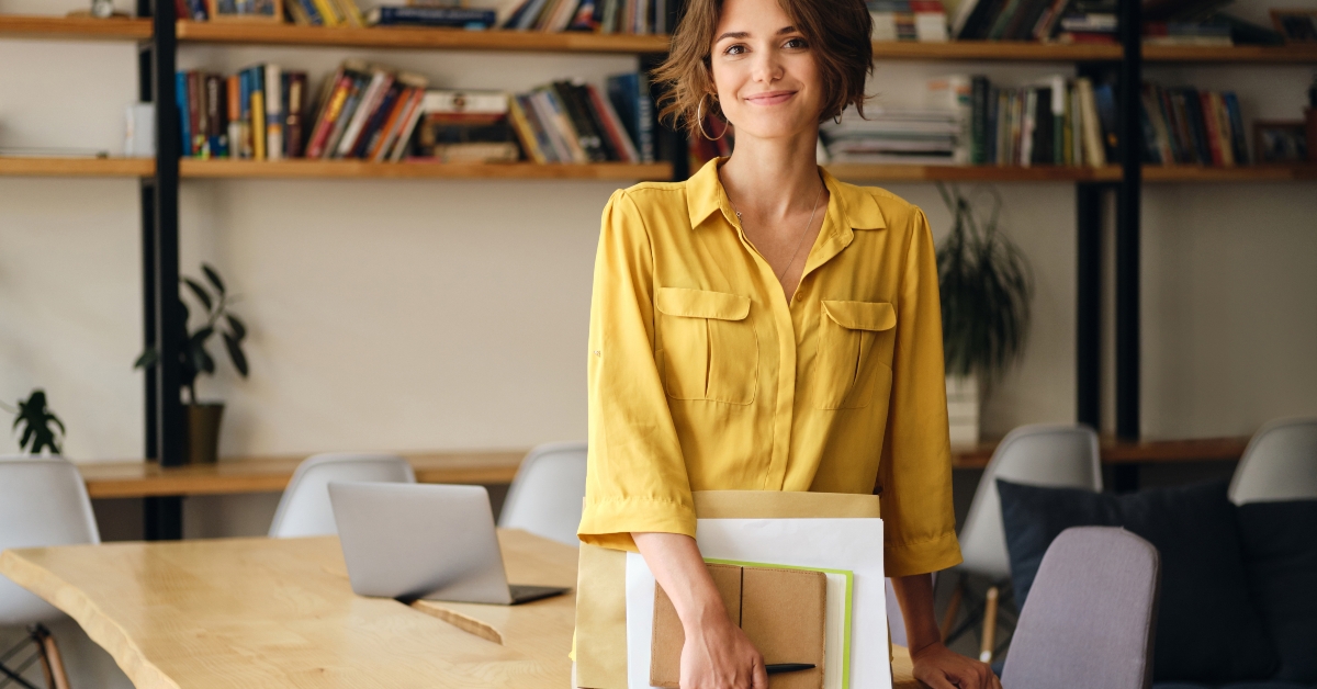 woman with notepad and papers