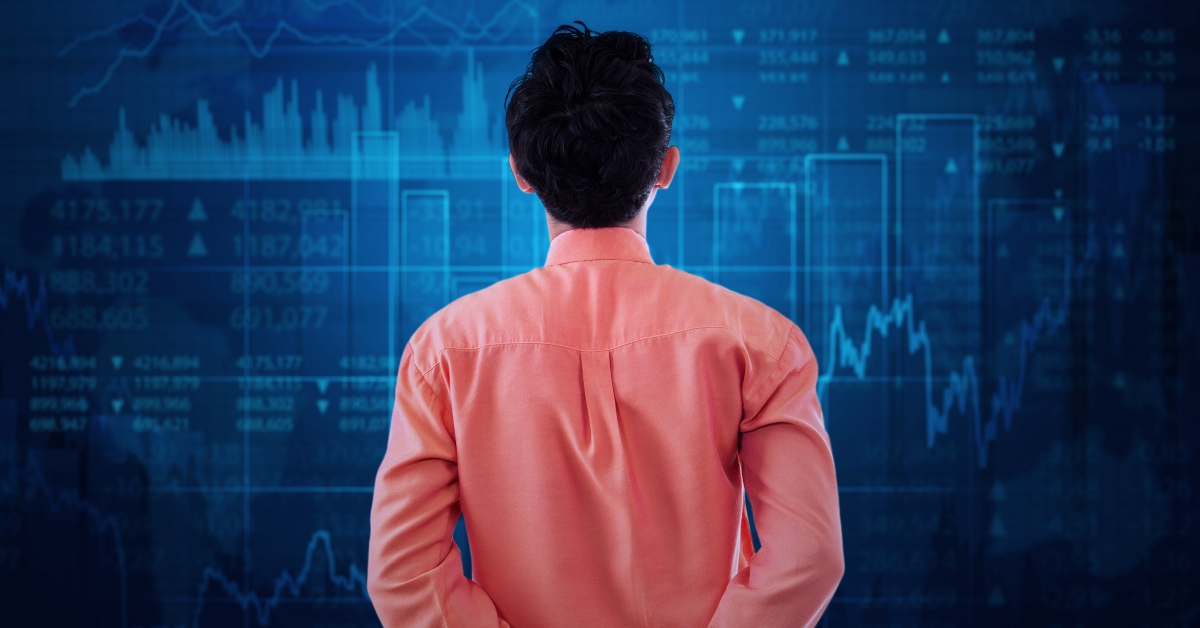worker watching at stock exchange graph