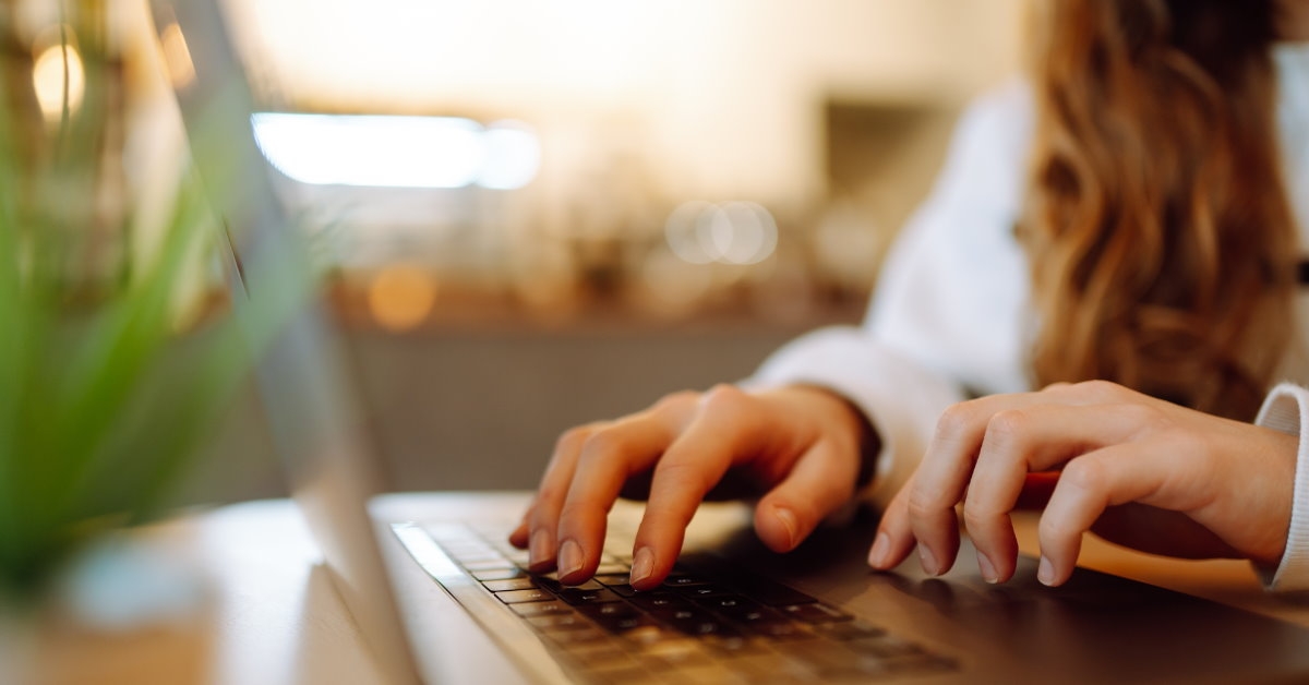 female remote working on laptop