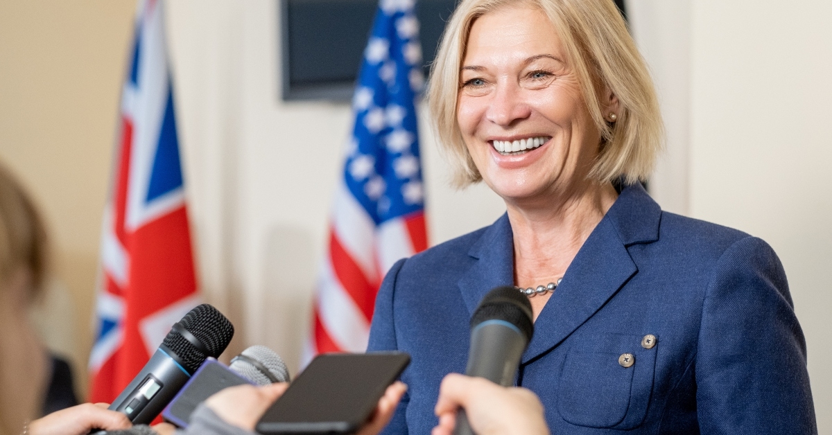mature female politician talking to press