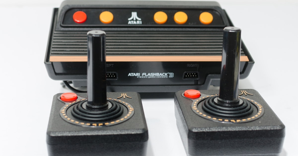 vintage plug n play console placed over white background