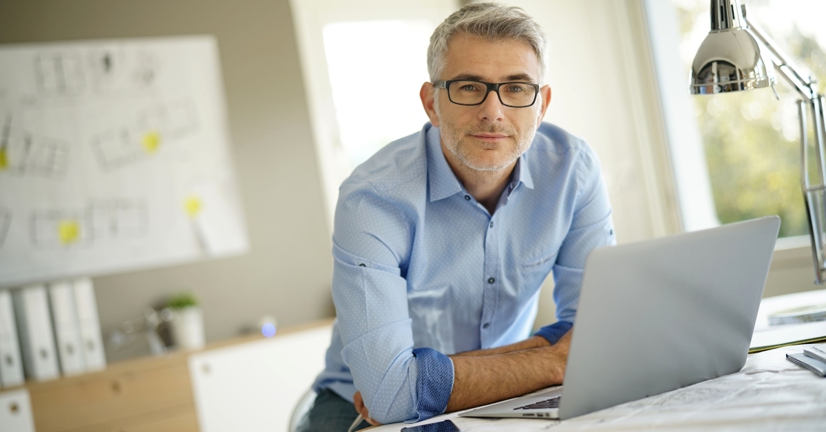 architect looking at camera in office