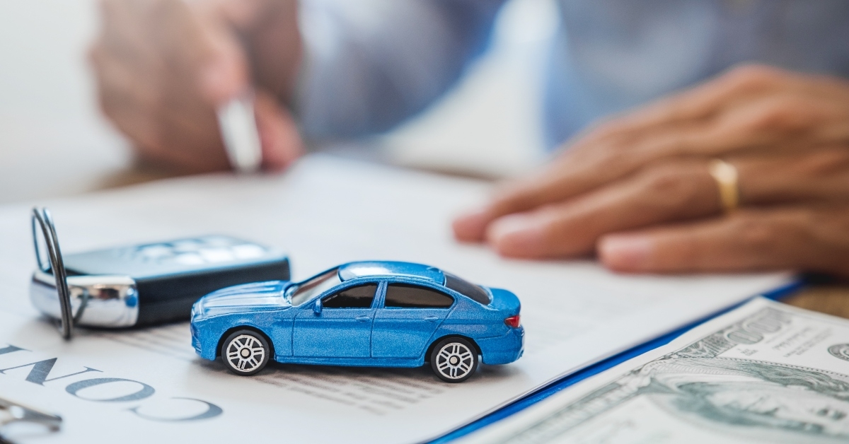 sales agent signs car loan contract