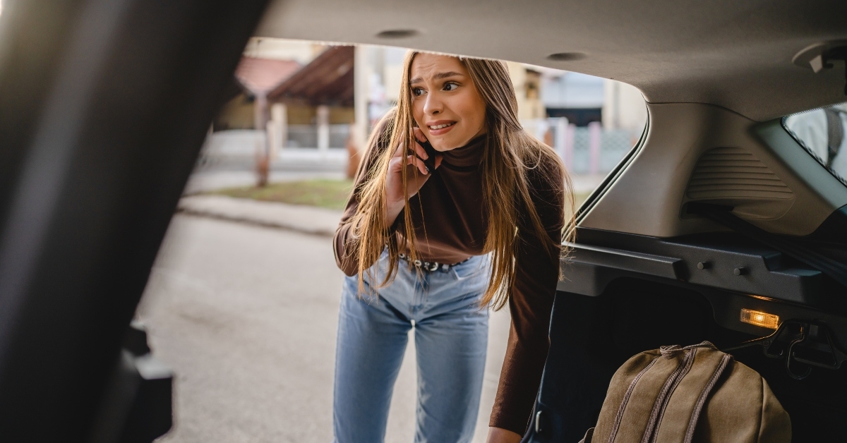 woman receiving bad news while talking on mobile phone