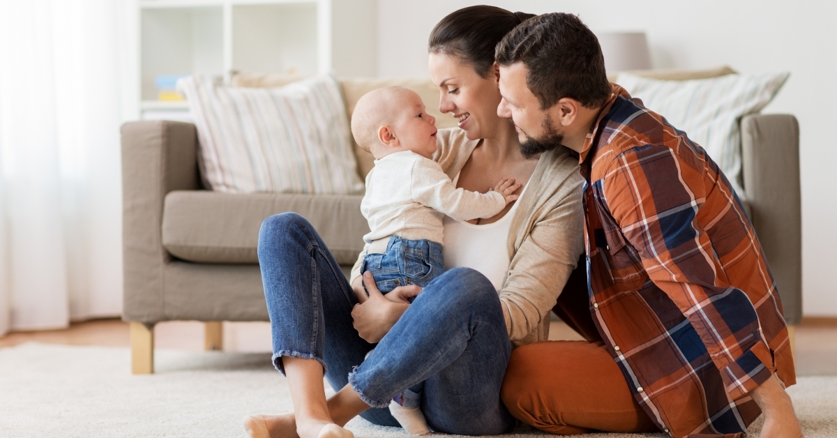 happy family with baby having fun at home