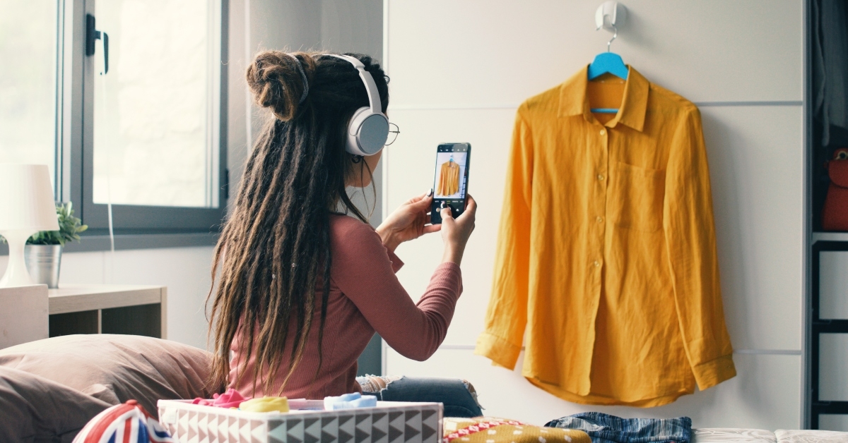 woman taking pictures of her clothes 
