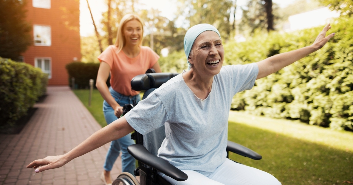 woman with cancer is sitting in a wheelchair