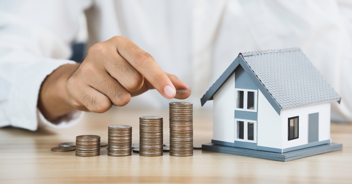 house model and coin holder money on the table