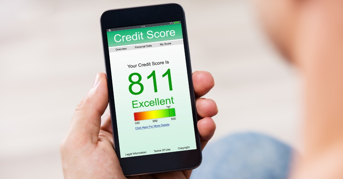 man holding smartphone showing credit score