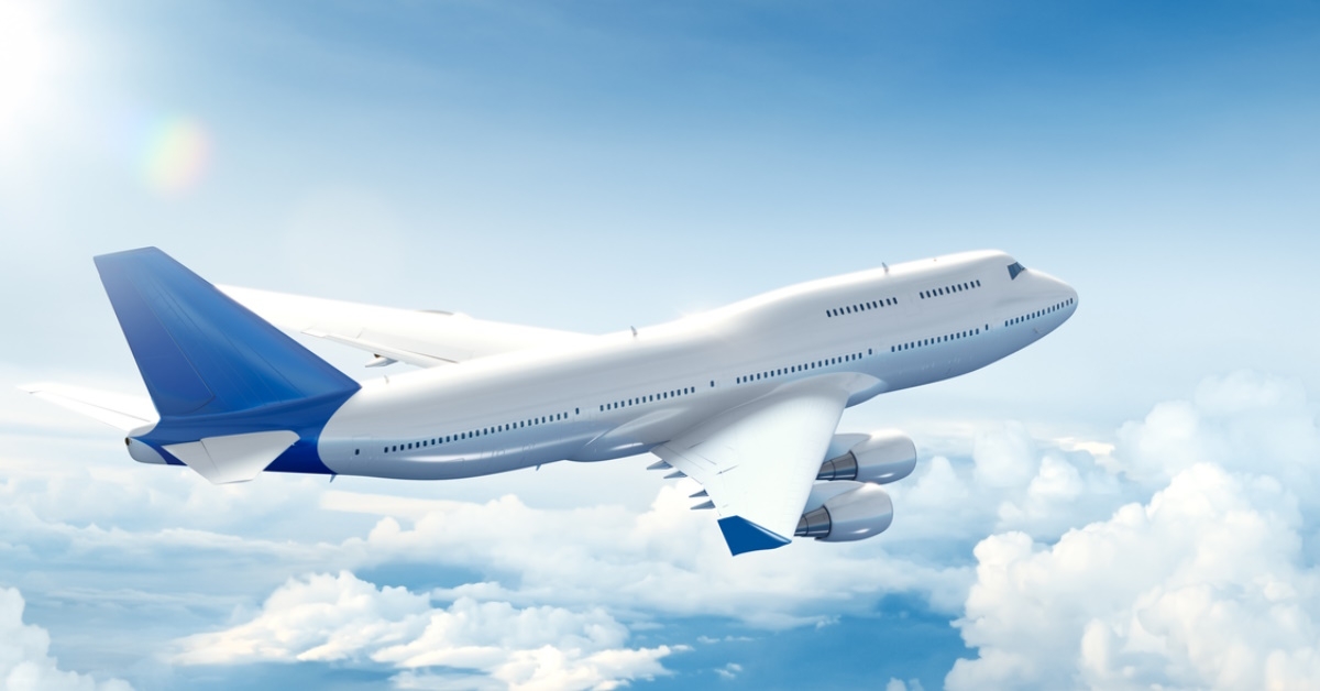 aeroplane flying above the clouds during day time