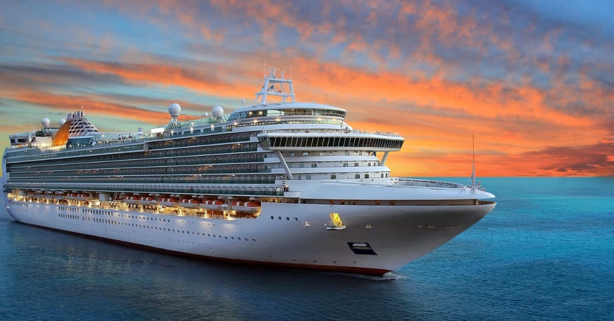 luxury cruise ship sailing in the middle of the sea at sunset