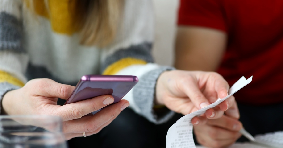 couple reviewing receipts 