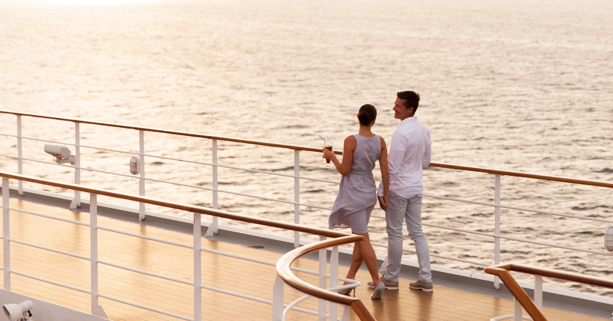 couple talking while walking on cruise ship