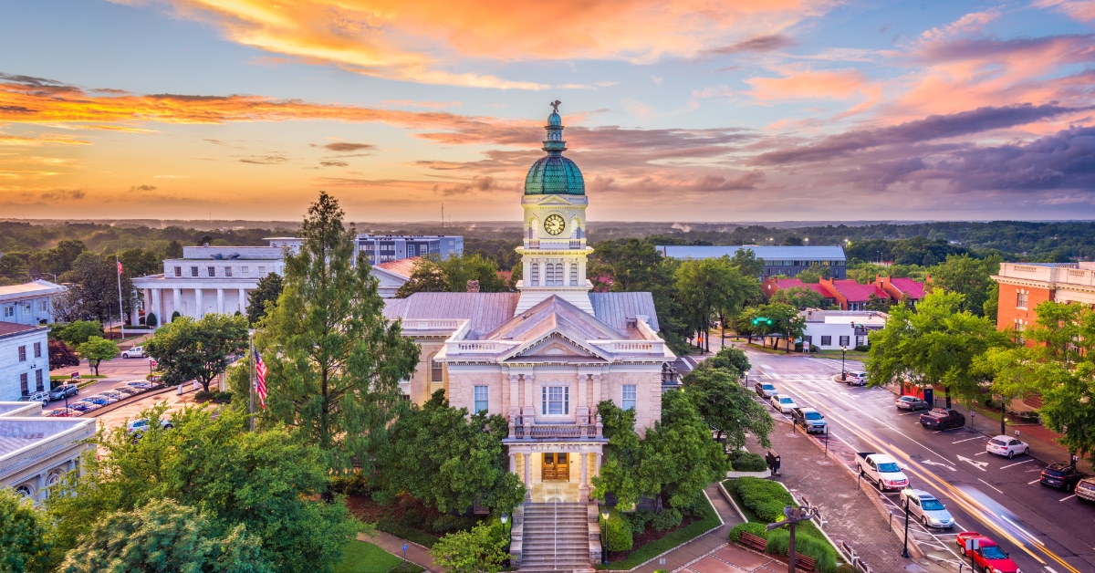 city hall building under orange sky in athens, georgia 