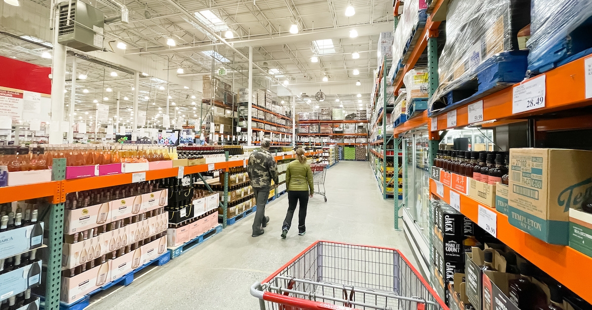 Two shoppers in the alcohol section at Costco