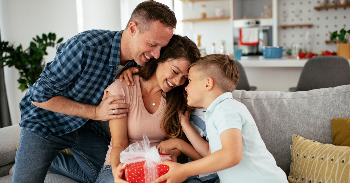 young sons are giving their mother a gift