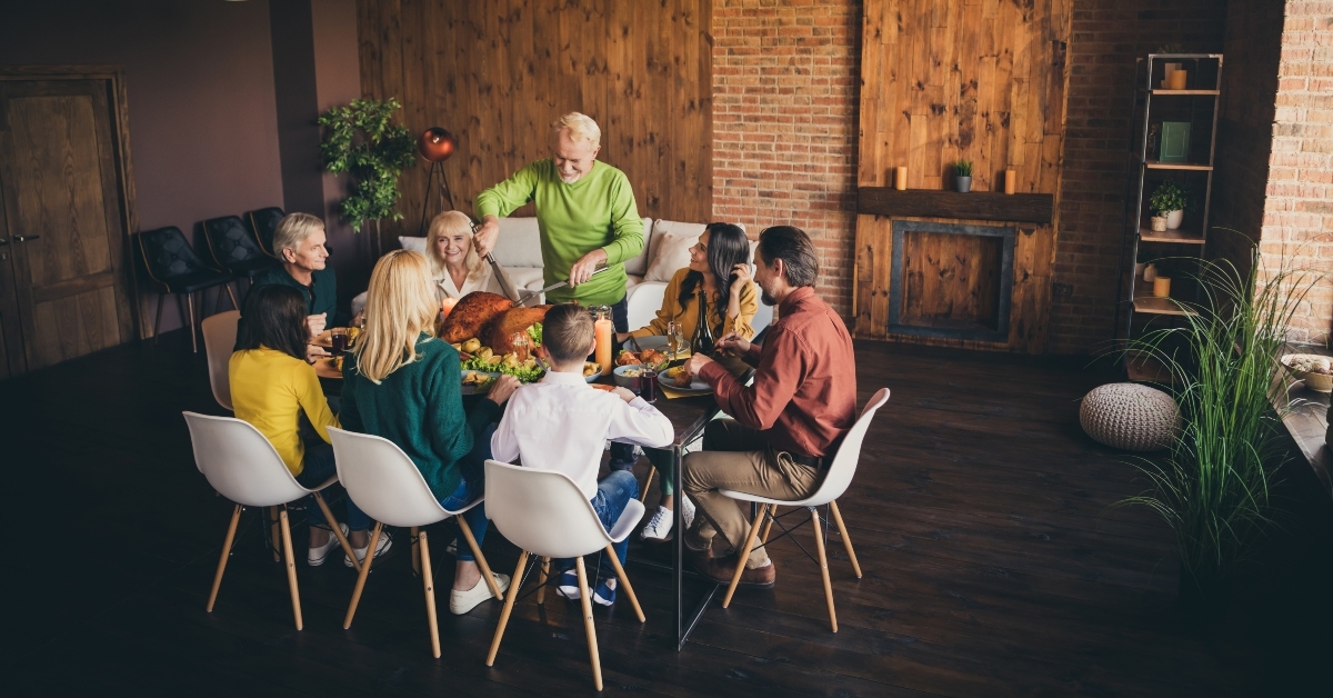 family sitting around festal served table
