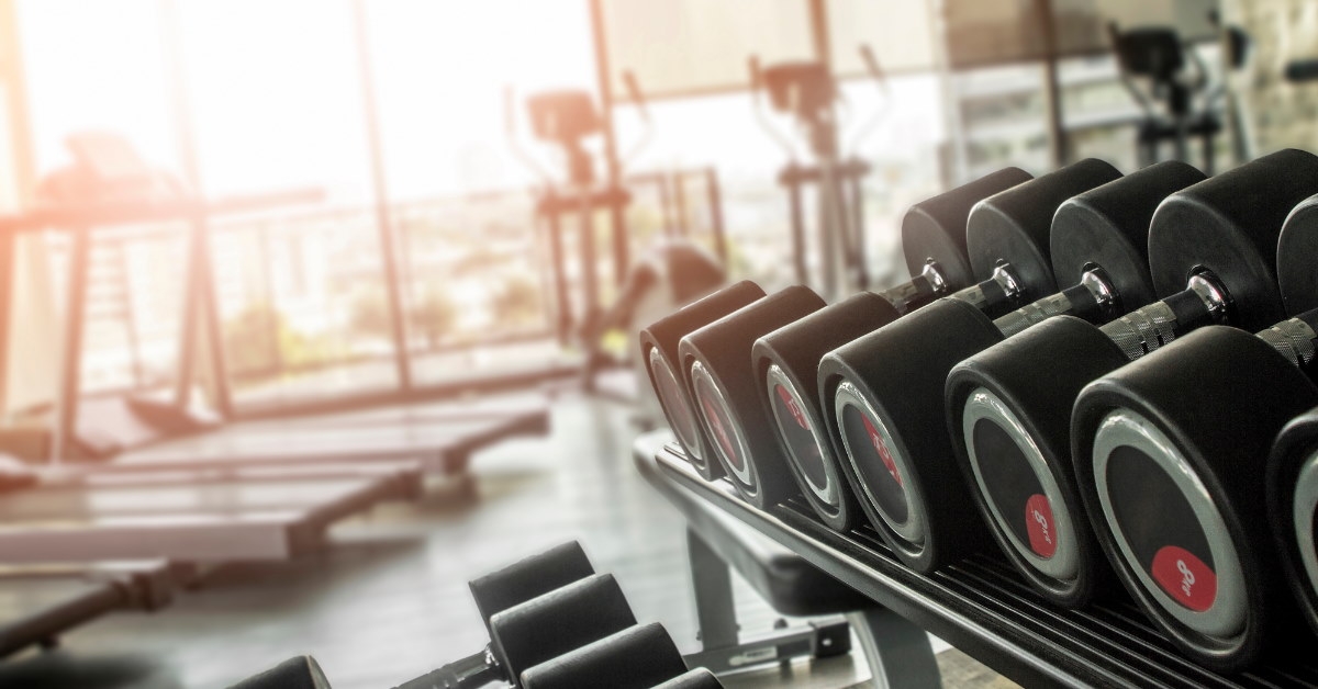 gym with dumbells and machines 