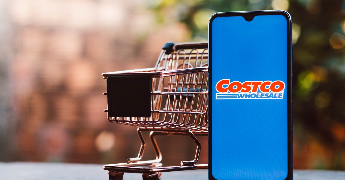 smartphone along with a shopping cart