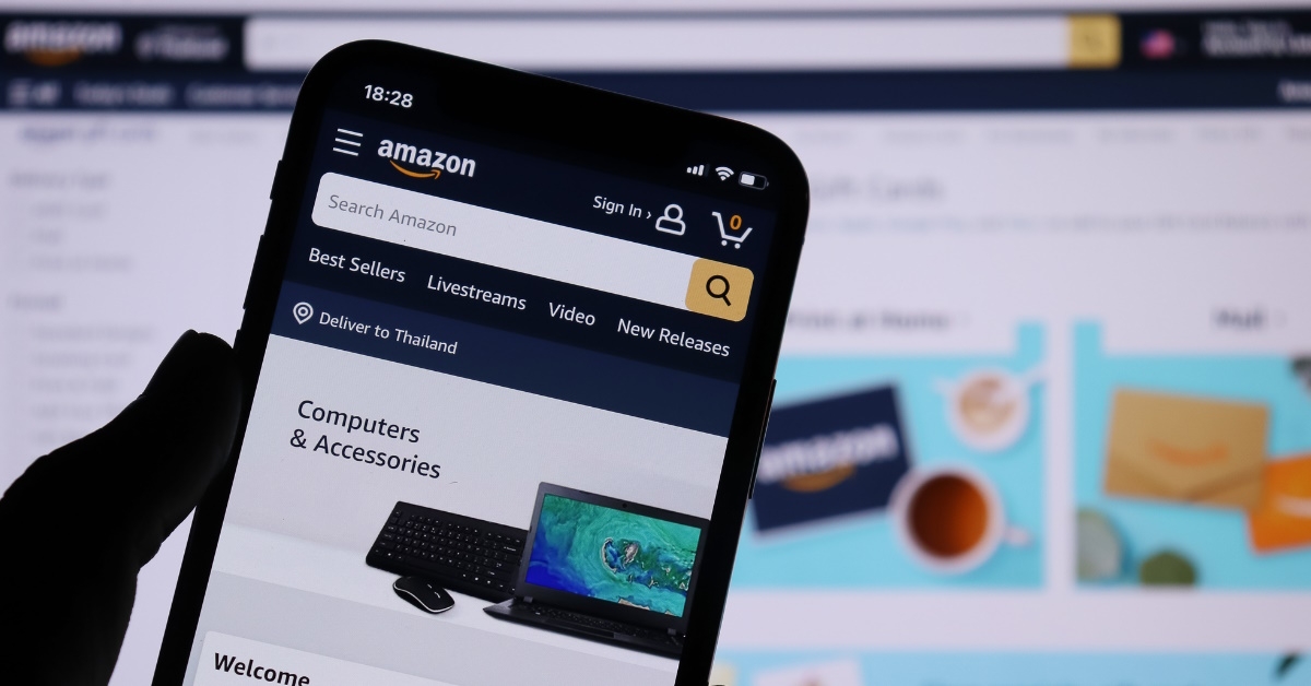 smartphone with amazon application over amazon website 