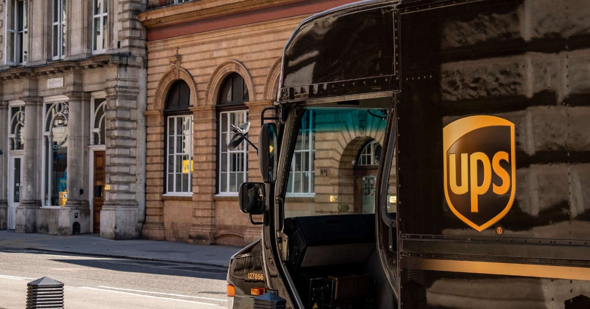 black color united parcel service truck parked in the street of london during day time