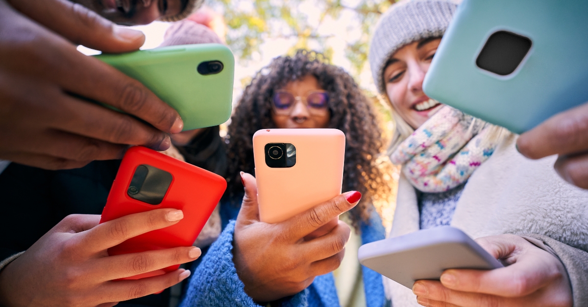 group of young teenagers friends using mobile cell