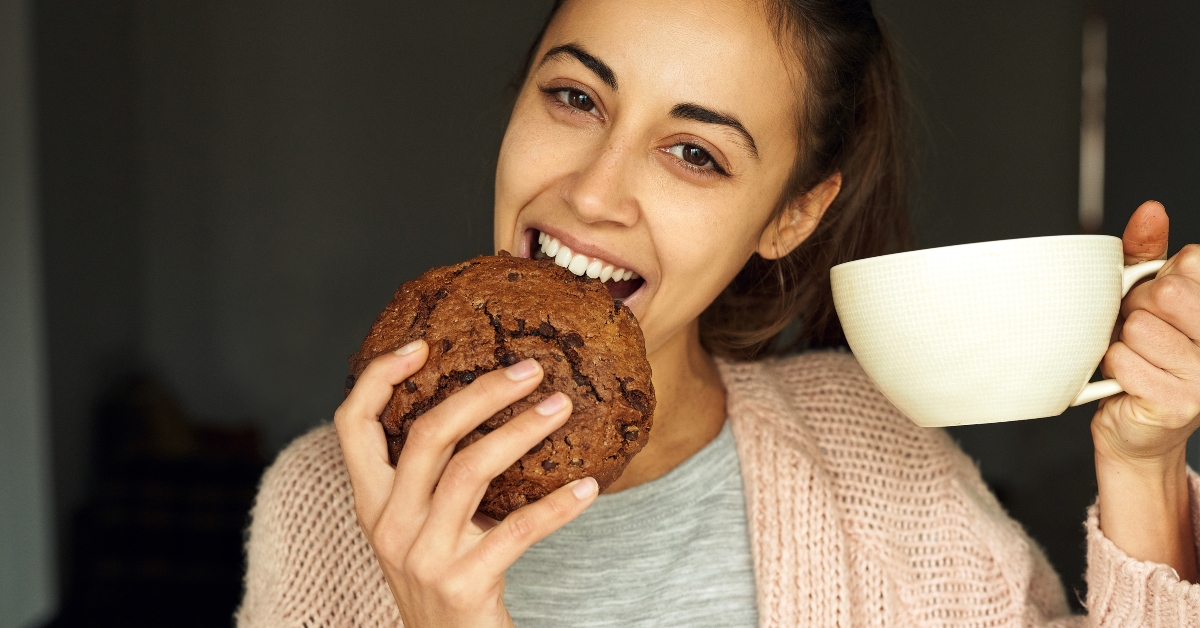 happy young woman with large cup tea