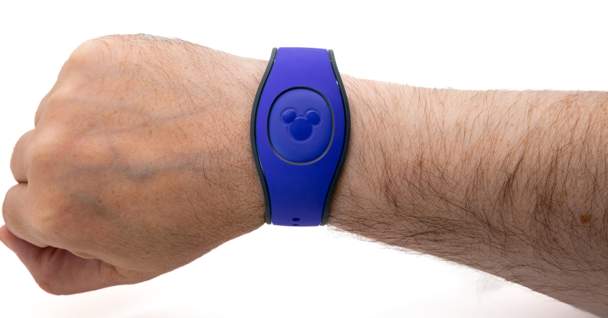 male wrist wearing a Disney Magicband