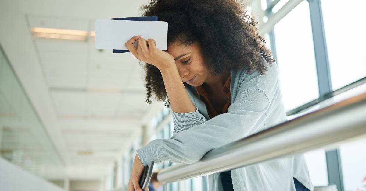 travel stressed and black woman at airport with headache