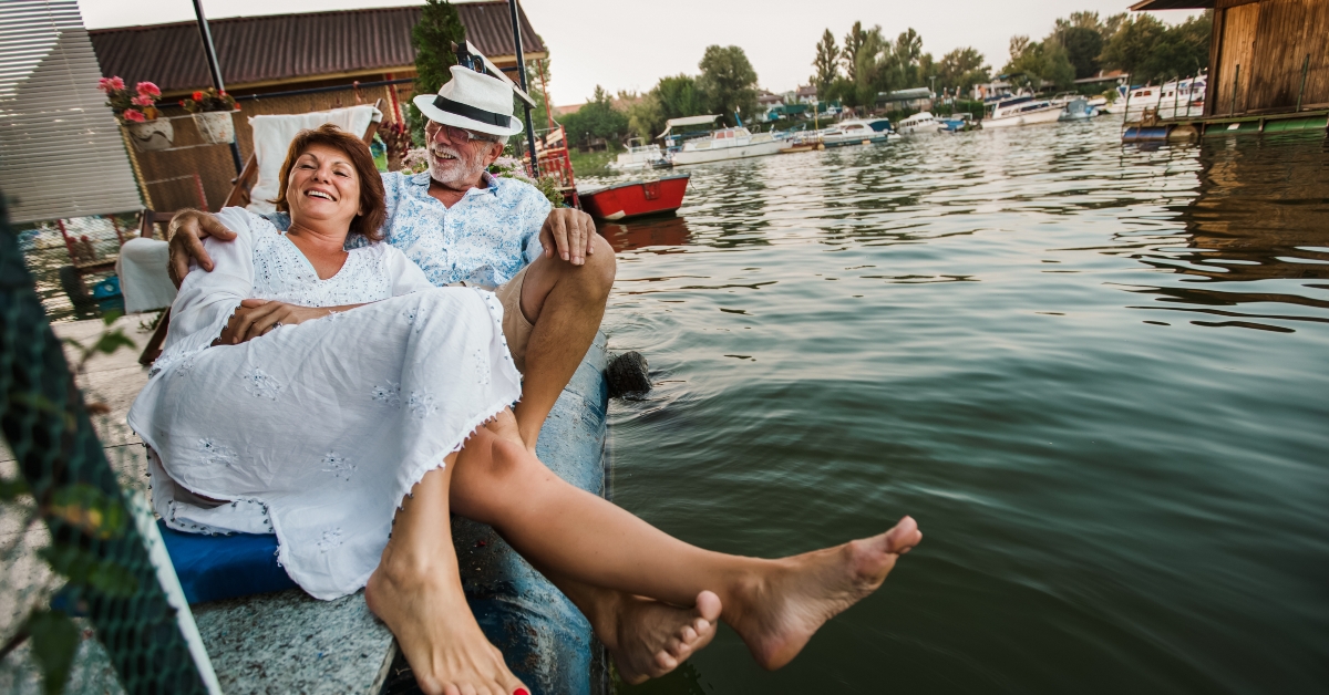 senior couple enjoying a day in the cottage near the river