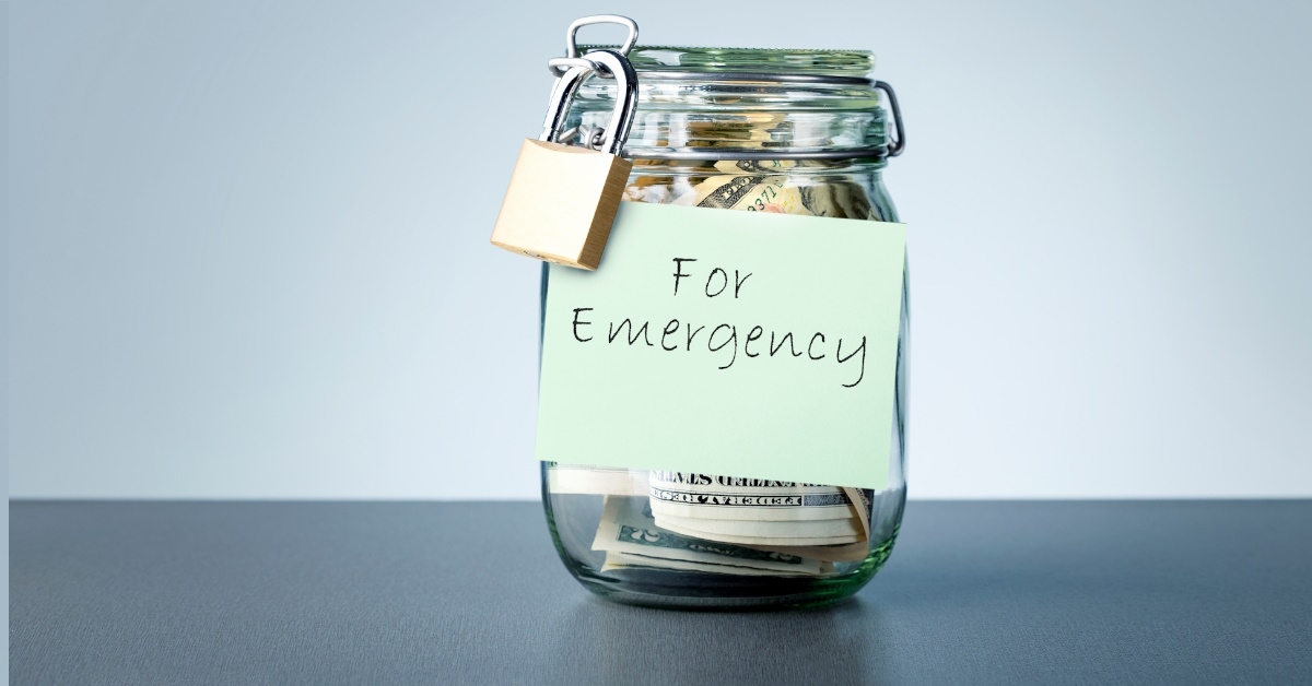 money locked in jar with emergency fund label on it 