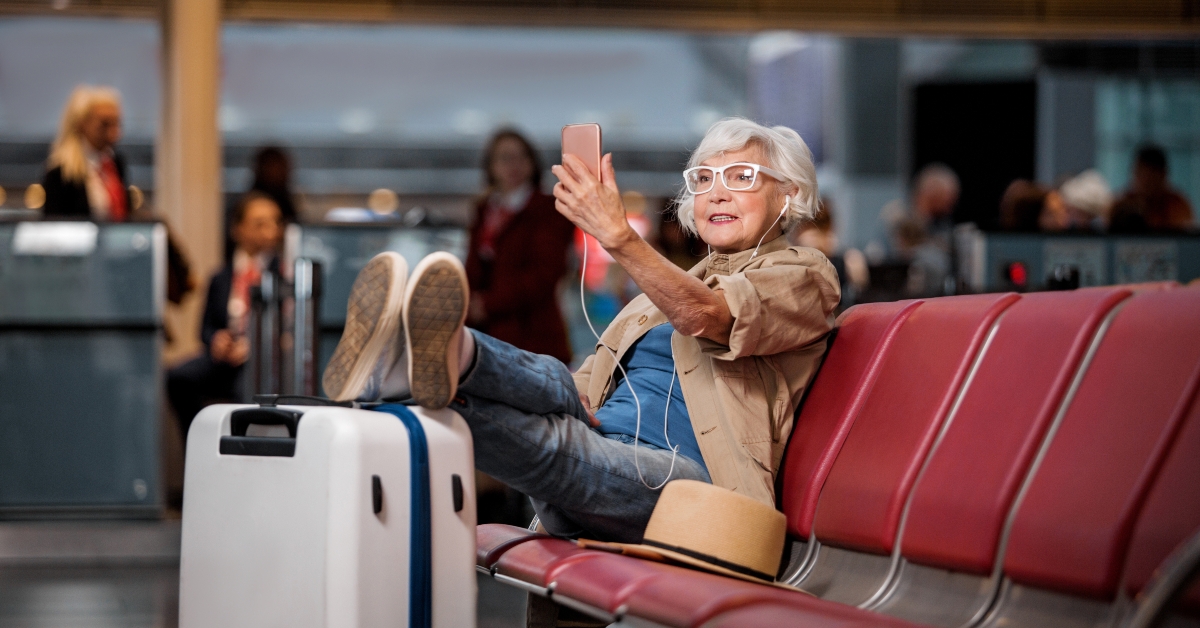 old lady is sitting on bench at airport lounge