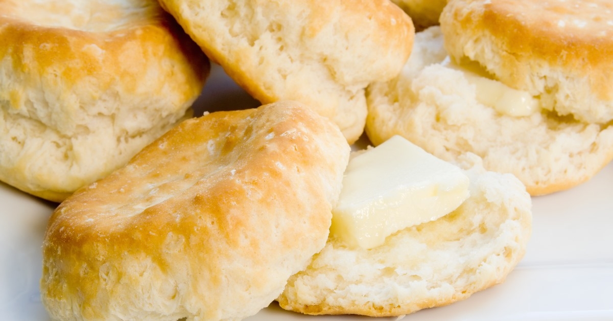 homemade biscuits with butter over white table