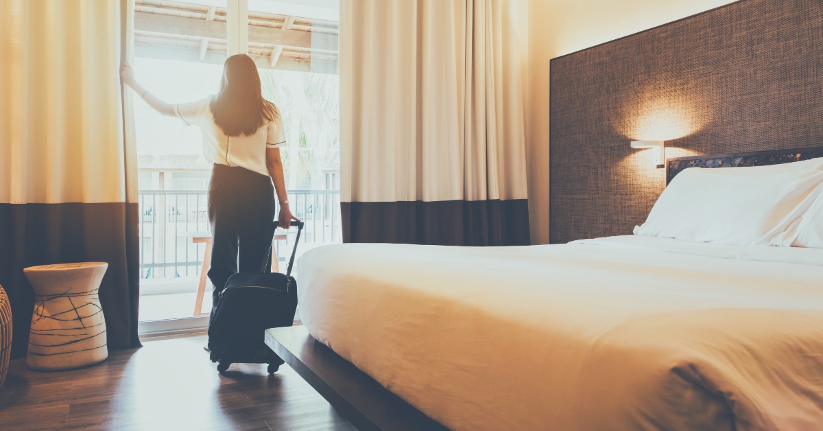 asian woman staying in a hotel room