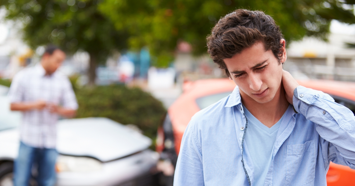 teenage driver suffering whiplash injury traffic accident