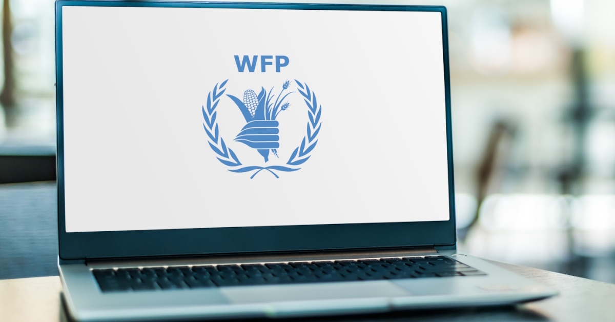 laptop at table having WFP logo on screen 