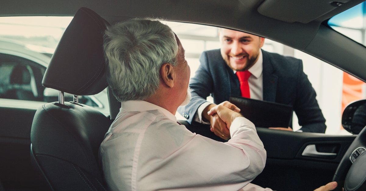 aged man buy car with dealer