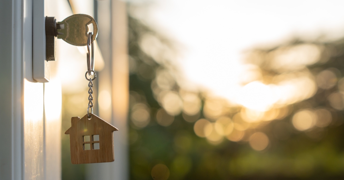 key having mini house golden key chain left out in door lock