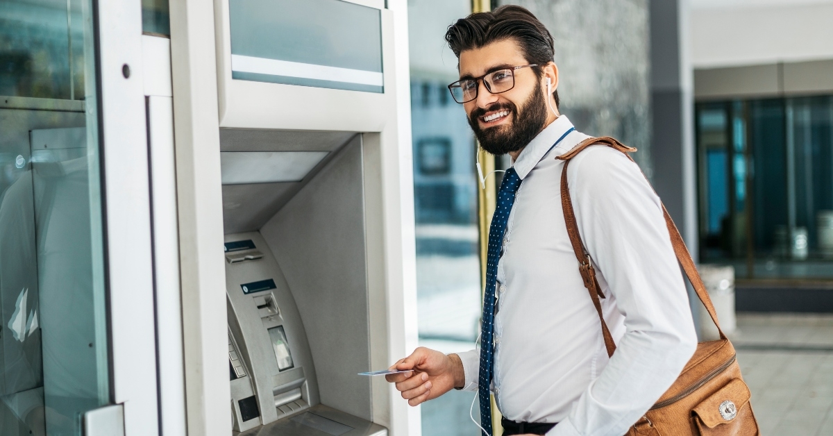 Man using ATM