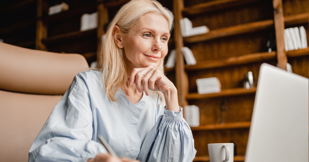 senior business working from home using laptop