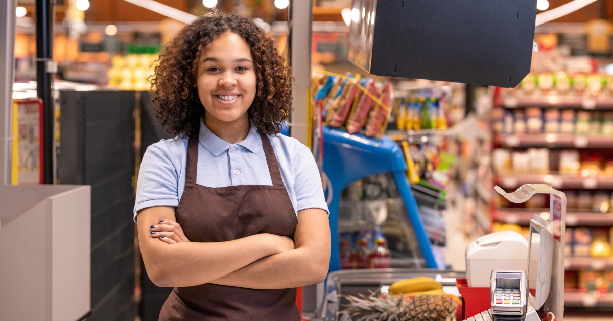 young smiling female sales clerk