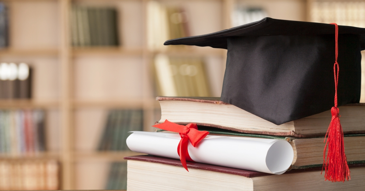 graduation cap and books
