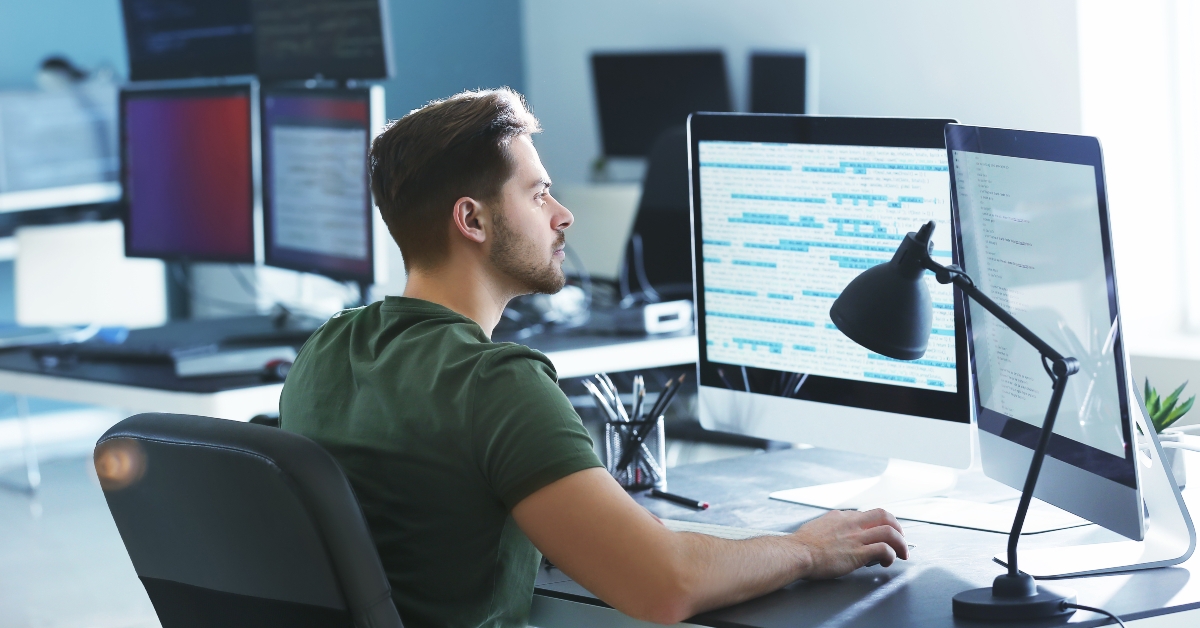 male programmer working in office