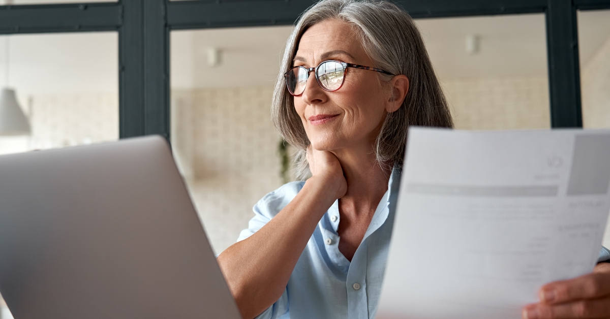 middle aged businesswoman using laptop