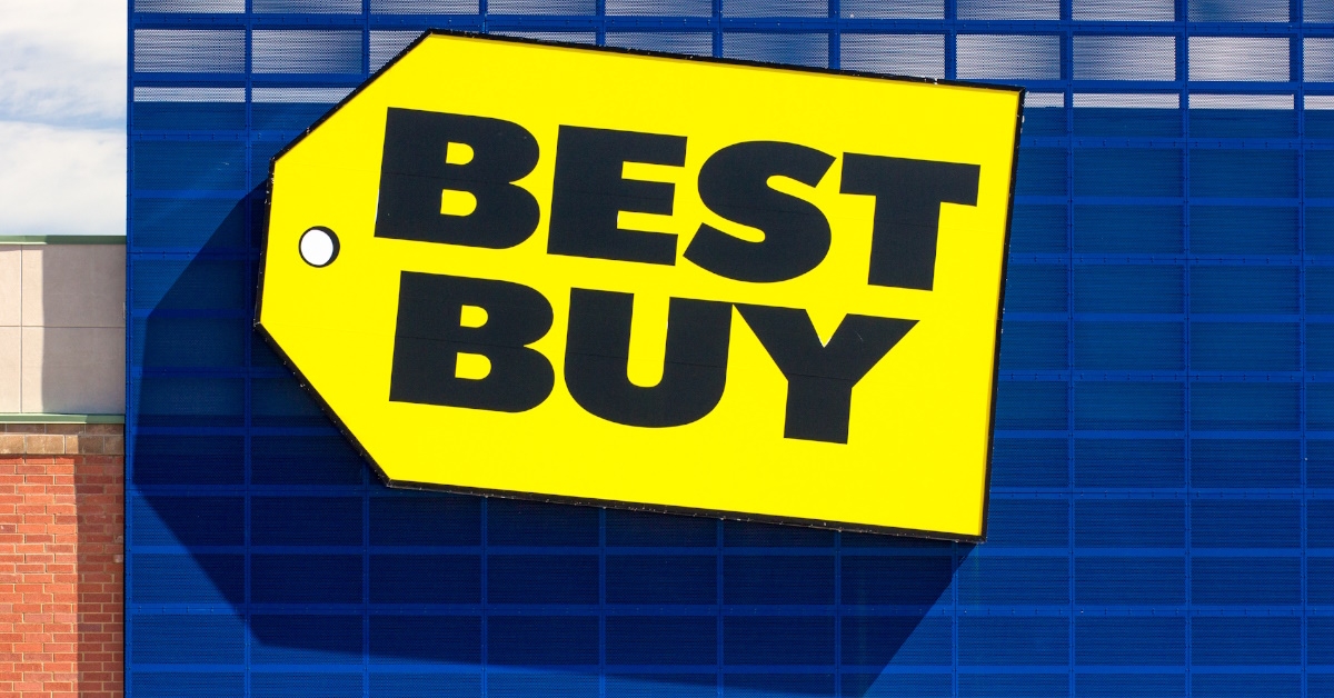best buy trademark logo on blue wall during day time