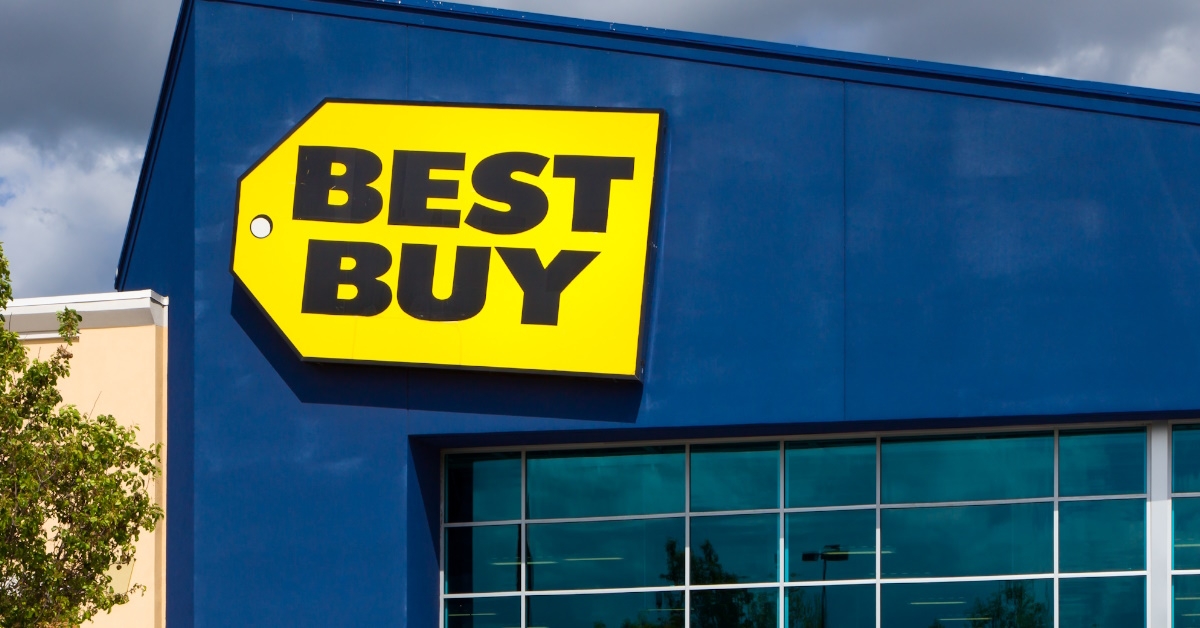 best buy trademark logo on store building with vacant entrance during day time