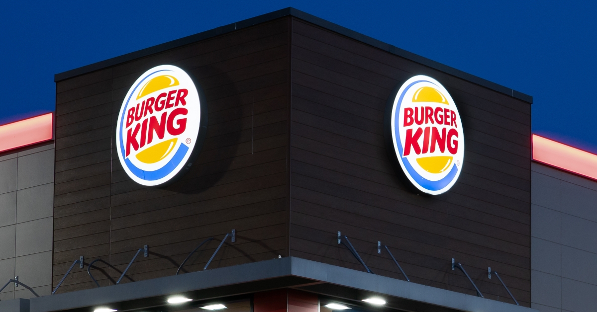 Burger King restaurant at twilight and trademark logo