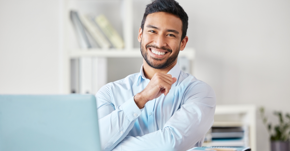 businessman smiles in office